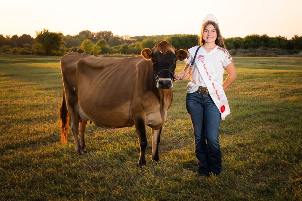 Canton High School senior Bella in her Dairy Princess sash with her cow at a local Northern NY farm.